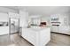 Open-concept kitchen with a large island, stainless steel appliances, and a view to the living room at 69 Arrowwood Way, Summerville, SC 29485