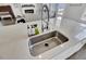 Close-up of the kitchen island featuring a stainless steel sink and modern faucet at 69 Arrowwood Way, Summerville, SC 29485