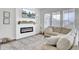 Cozy living room with fireplace, large windows, and plush carpeting at 69 Arrowwood Way, Summerville, SC 29485