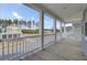 Back porch with composite decking offering serene views of the neighborhood and road at 69 Arrowwood Way, Summerville, SC 29485