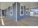 Corner of the back porch featuring composite decking and vinyl siding at 69 Arrowwood Way, Summerville, SC 29485