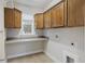 Laundry room features built-in cabinets and countertop space at 710 Quintan St, Summerville, SC 29486