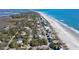 Coastal community featuring homes nestled amongst trees along the beachfront at 716 E Arctic Ave, Folly Beach, SC 29439