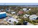 Aerial neighborhood shot of the mix of homes, palm trees, and foliage at 716 E Arctic Ave, Folly Beach, SC 29439