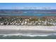 Stunning aerial view of a beach house located near the ocean and beautiful Charleston at 716 E Arctic Ave, Folly Beach, SC 29439