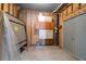 Unfinished basement area with storage cabinets and utilities at 716 E Arctic Ave, Folly Beach, SC 29439
