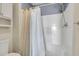 Bright bathroom featuring white shower and shower curtain for a clean and functional space at 716 E Arctic Ave, Folly Beach, SC 29439