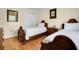 Bedroom featuring two twin beds, wood floors, neutral walls and closet at 716 E Arctic Ave, Folly Beach, SC 29439