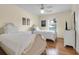 Well-lit bedroom featuring two twin beds and a window with lots of natural light at 716 E Arctic Ave, Folly Beach, SC 29439