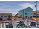 Cozy deck with comfortable seating, perfect for enjoying the ocean breeze and scenic views at 716 E Arctic Ave, Folly Beach, SC 29439