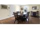 Open-concept dining room featuring hardwood floors and a spacious layout, perfect for entertaining guests at 716 E Arctic Ave, Folly Beach, SC 29439