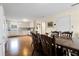 Open-concept dining room featuring hardwood floors and a spacious layout connected to the kitchen at 716 E Arctic Ave, Folly Beach, SC 29439