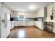 Traditional kitchen with plenty of cabinet space and hardwood style floors for a timeless appeal at 716 E Arctic Ave, Folly Beach, SC 29439