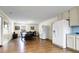 Open living space with dining area and kitchen featuring hardwood floors and neutral color tones at 716 E Arctic Ave, Folly Beach, SC 29439