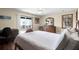 Light-filled bedroom features a ceiling fan and sliding glass doors leading to a private deck at 716 E Arctic Ave, Folly Beach, SC 29439