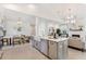 Bright open-concept kitchen with a large island, stainless steel appliances, and a view of the dining and living areas at 716 Minton Rd, Charleston, SC 29412