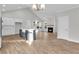 Open-concept living room with vaulted ceilings, fireplace, and island at 718 Minton Rd, Charleston, SC 29412