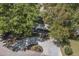 Scenic aerial view of a residence with a gravel driveway and beautiful landscaping with mature trees at 750 Atlantic St, Mount Pleasant, SC 29464
