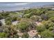 Aerial shot overlooking a park, green space, and recreation equipment with large trees, foliage and the harbor at 750 Atlantic St, Mount Pleasant, SC 29464
