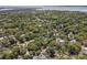 Expansive aerial view of a neighborhood with houses nestled among lush green trees and foliage at 750 Atlantic St, Mount Pleasant, SC 29464