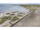 Stunning aerial view of the walkway with palm trees and marshes, leading to a picturesque coastline and harbor at 750 Atlantic St, Mount Pleasant, SC 29464