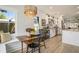 Open-concept kitchen with bright breakfast nook, light fixtures, and access to backyard at 750 Atlantic St, Mount Pleasant, SC 29464