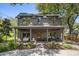Charming two-story home featuring a welcoming front porch and meticulously landscaped front yard at 750 Atlantic St, Mount Pleasant, SC 29464