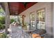 Inviting front porch featuring comfortable seating, brick flooring and a ceiling fan at 750 Atlantic St, Mount Pleasant, SC 29464