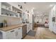 Bright kitchen featuring white cabinets, stainless steel appliances, and wood countertops, connecting seamlessly to the living area at 750 Atlantic St, Mount Pleasant, SC 29464