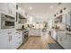 Bright kitchen with white cabinetry, stainless appliances, and breakfast nook flooded with natural light at 750 Atlantic St, Mount Pleasant, SC 29464
