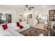 Bright living room seamlessly transitions to a modern kitchen with white cabinets and stainless steel appliances at 750 Atlantic St, Mount Pleasant, SC 29464