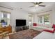 Bright living room featuring a large comfortable sofa, big windows and wood flooring at 750 Atlantic St, Mount Pleasant, SC 29464