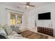 Comfortable living room with a neutral color palette, ceiling fan, large window and a patterned rug at 750 Atlantic St, Mount Pleasant, SC 29464