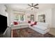 Bright living room featuring a large comfortable sofa, big windows and wood flooring at 750 Atlantic St, Mount Pleasant, SC 29464