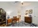 Traditional office with wooden desk, storage chest, and neutral blue rug creating a work-from-home haven at 750 Atlantic St, Mount Pleasant, SC 29464