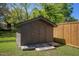 Detached storage shed in backyard with double doors and access steps at 750 Atlantic St, Mount Pleasant, SC 29464