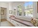 Bright window seat with storage drawers and decorative pillows offers a cozy nook at 750 Atlantic St, Mount Pleasant, SC 29464