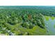 Aerial view of waterfront property with lush trees, private docks, and serene marsh landscapes at 750 Lakenheath Dr, Mount Pleasant, SC 29464