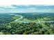 Scenic aerial shot of property nestled among trees, near marshlands and water access, offering privacy at 750 Lakenheath Dr, Mount Pleasant, SC 29464