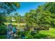 Picturesque backyard featuring a private dock, marsh views, and lush greenery at 750 Lakenheath Dr, Mount Pleasant, SC 29464