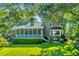 Beautiful backyard with a brick home and inviting screened-in porch at 750 Lakenheath Dr, Mount Pleasant, SC 29464