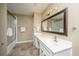Well-lit bathroom with white countertops, modern sink, large mirror, and a shower with sliding glass doors at 750 Lakenheath Dr, Mount Pleasant, SC 29464