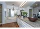 Elegant bathroom with granite countertops, double sinks, modern fixtures, with tub and shower in the background at 750 Lakenheath Dr, Mount Pleasant, SC 29464