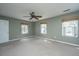 Spacious bedroom featuring carpet, a ceiling fan, natural light through the windows, and neutral walls at 750 Lakenheath Dr, Mount Pleasant, SC 29464
