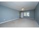 Large bedroom with light blue walls, carpet, ceiling fan, one window, and a closet at 750 Lakenheath Dr, Mount Pleasant, SC 29464