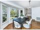 Dining room with bay window offering natural light, hardwood flooring, and stylish decor at 750 Lakenheath Dr, Mount Pleasant, SC 29464