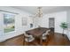 Bright formal dining room featuring hardwood floors, large windows, and modern lighting at 750 Lakenheath Dr, Mount Pleasant, SC 29464