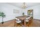 Bright formal dining room featuring hardwood floors, large windows, and modern lighting at 750 Lakenheath Dr, Mount Pleasant, SC 29464