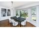 Dining room with bay window, dark table, light colored chairs, and stylish decor at 750 Lakenheath Dr, Mount Pleasant, SC 29464