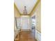Bright foyer featuring hardwood floors, elegant lighting, mirror and decorative wallpaper at 750 Lakenheath Dr, Mount Pleasant, SC 29464